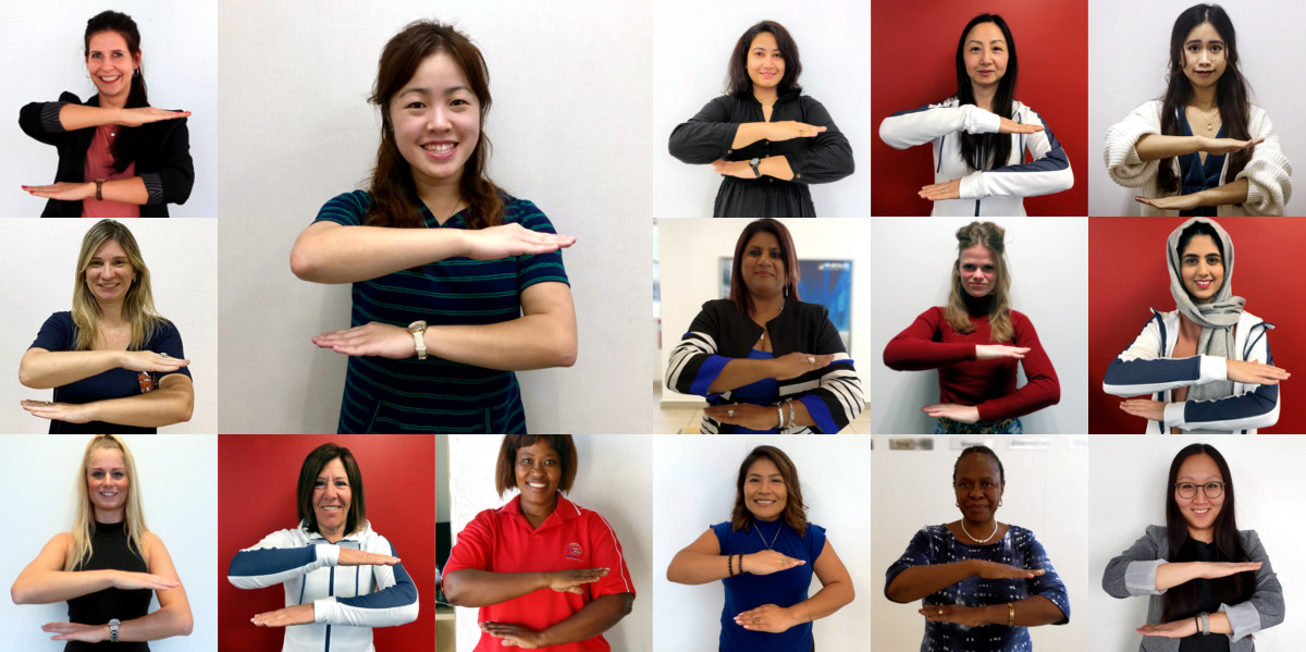 Our brilliant female colleagues show the each for equal sign to promote equality.
